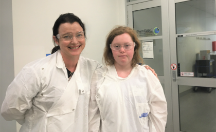 Two women in white lab coats